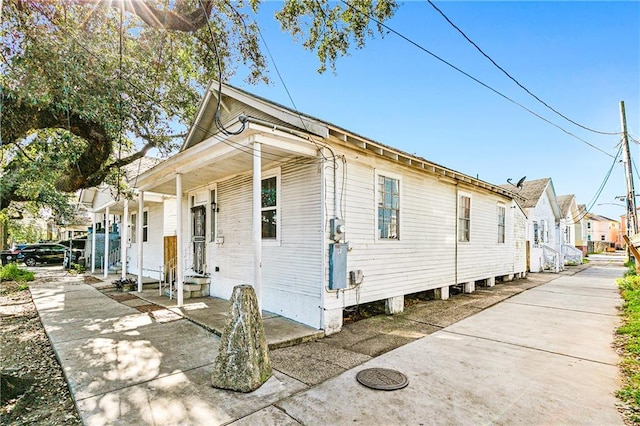 view of property exterior with covered porch