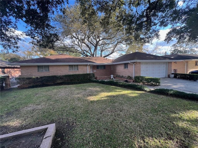 ranch-style house featuring a garage and a front yard