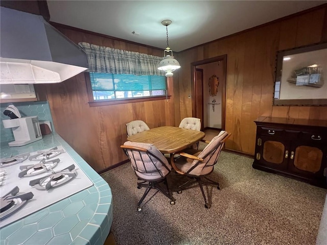 dining room with wooden walls