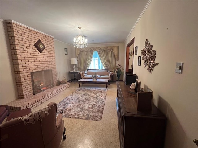 living room with ornamental molding, a fireplace, and a chandelier