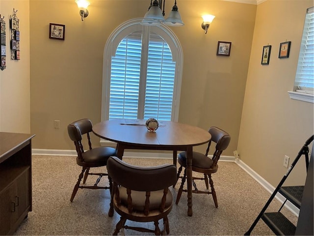 dining space with a healthy amount of sunlight and a chandelier