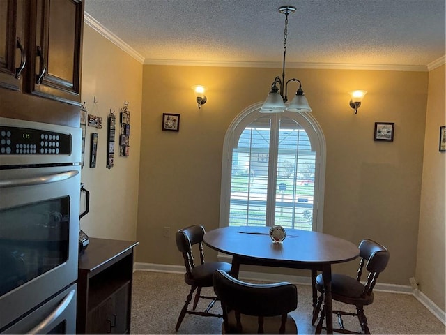 dining space with crown molding, plenty of natural light, and a textured ceiling