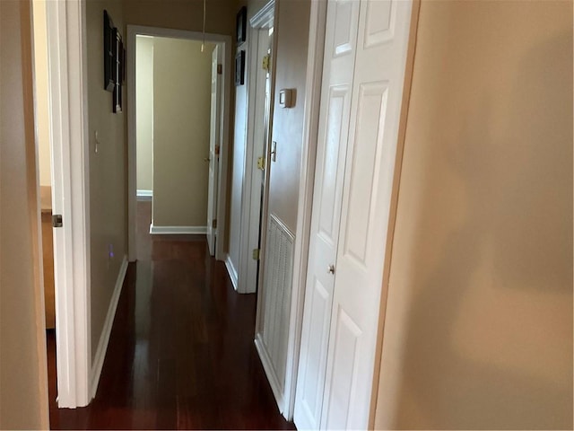 hall featuring dark wood-type flooring