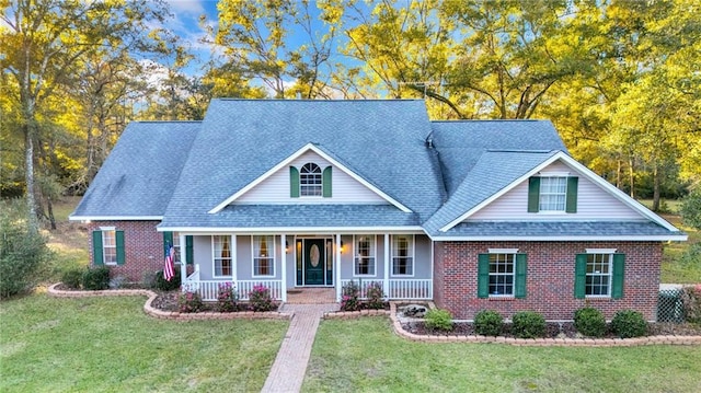 view of front of house with a front yard and a porch