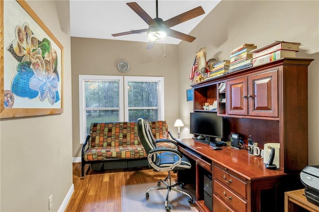 office featuring light hardwood / wood-style floors and ceiling fan