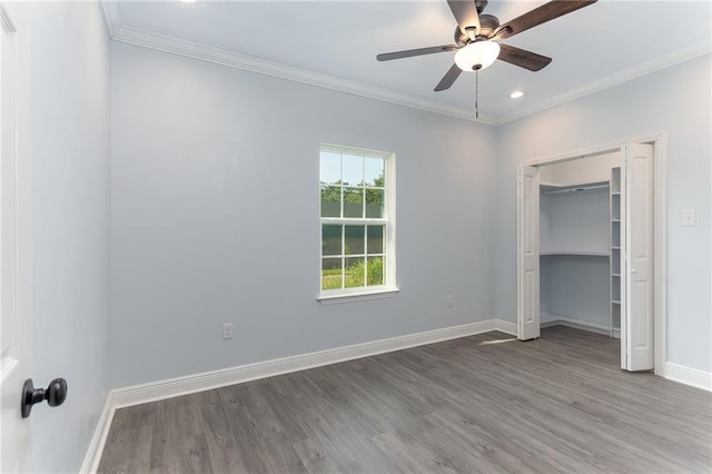 unfurnished bedroom with hardwood / wood-style floors, a closet, ceiling fan, and ornamental molding