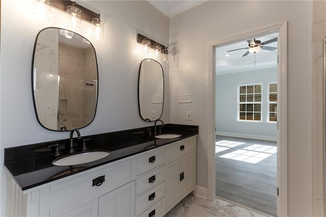 bathroom with wood-type flooring, vanity, ceiling fan, and crown molding