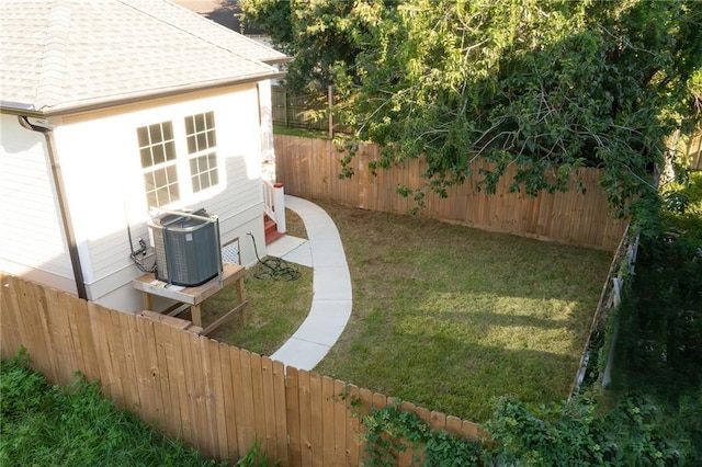 view of yard featuring central air condition unit