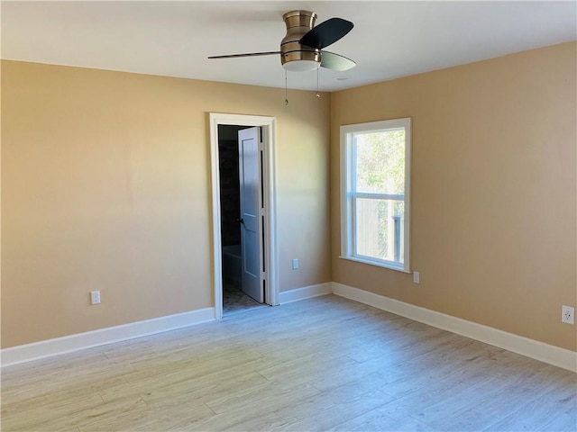 empty room featuring ceiling fan and light wood-type flooring