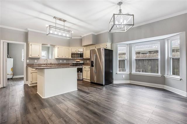 kitchen featuring pendant lighting, a center island, stainless steel appliances, and dark hardwood / wood-style floors