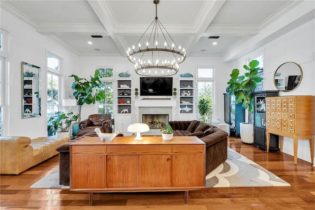 living room featuring hardwood / wood-style floors, plenty of natural light, coffered ceiling, and beam ceiling