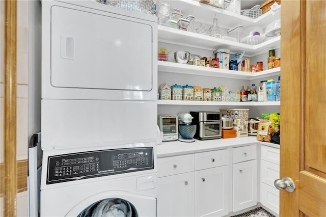 laundry room featuring stacked washing maching and dryer