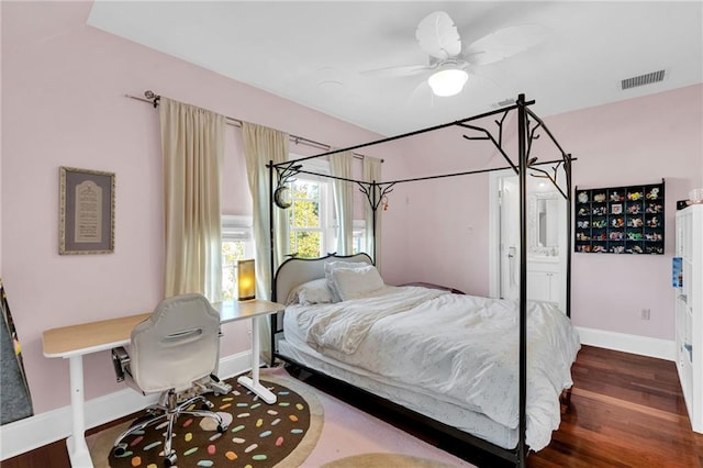 bedroom with ceiling fan, wood-type flooring, and ensuite bathroom