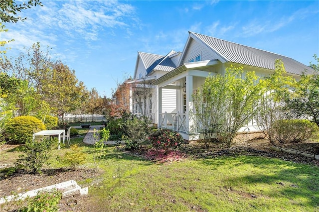 view of property exterior with a lawn