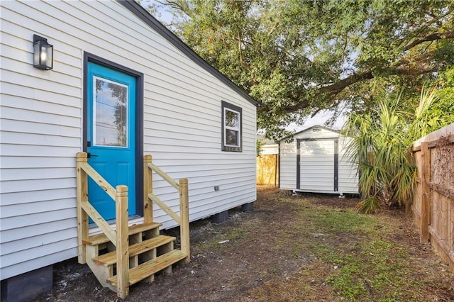 view of side of property with a shed