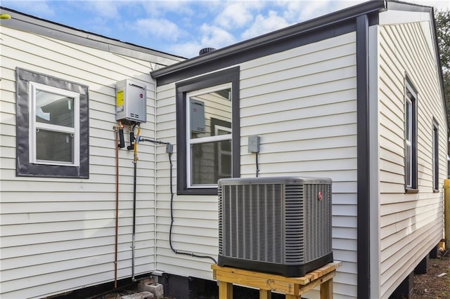 view of side of property with central AC unit