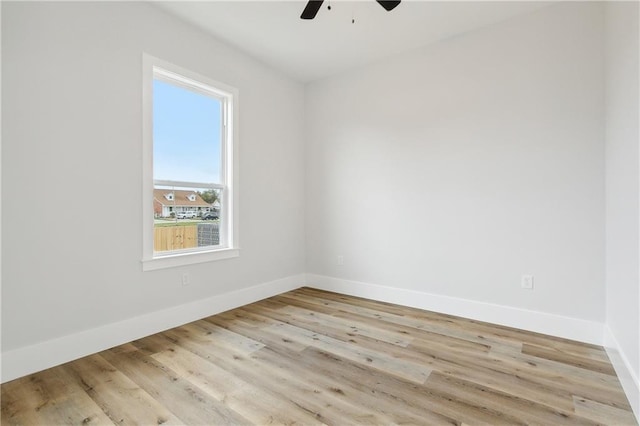 spare room with light hardwood / wood-style floors and ceiling fan