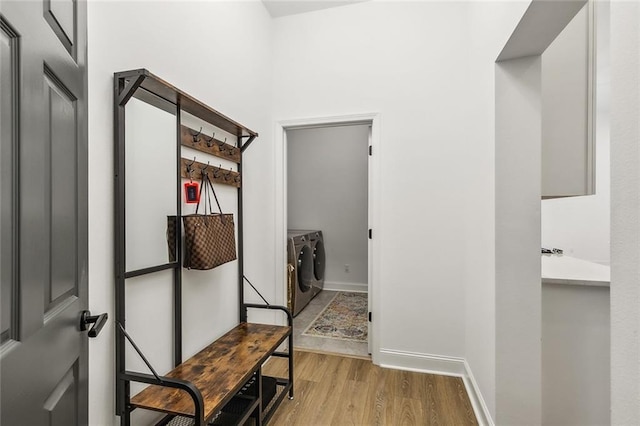 mudroom featuring washer and dryer and light wood-type flooring