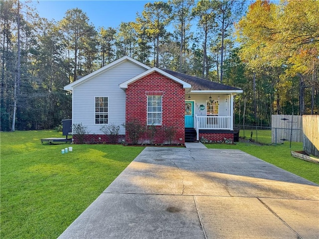 ranch-style house with a porch and a front lawn