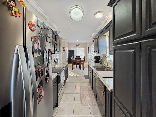 kitchen with light stone countertops, sink, stainless steel appliances, crown molding, and light tile patterned flooring