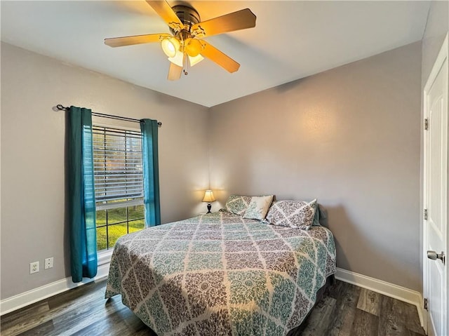 bedroom featuring ceiling fan and dark wood-type flooring