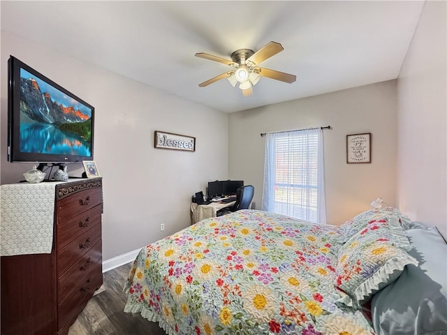 bedroom with ceiling fan and dark hardwood / wood-style flooring