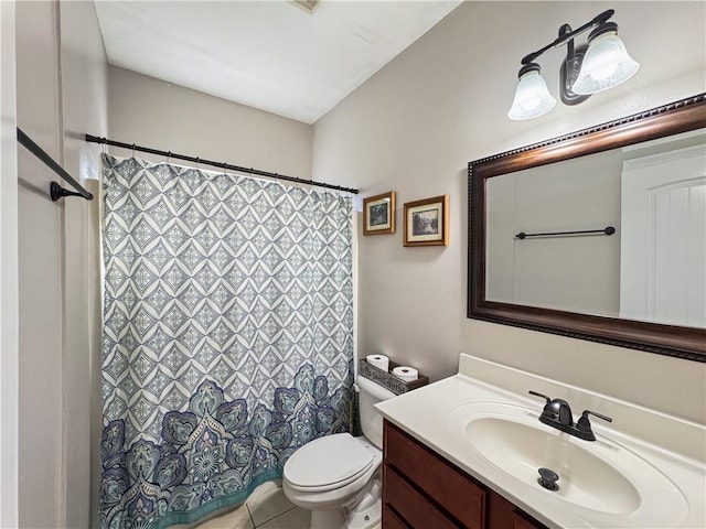 bathroom with tile patterned floors, vanity, and toilet