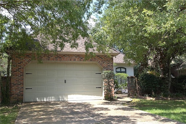 ranch-style house featuring a garage