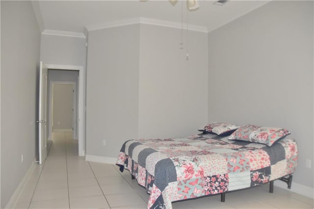 bedroom with ceiling fan, light tile patterned floors, and ornamental molding