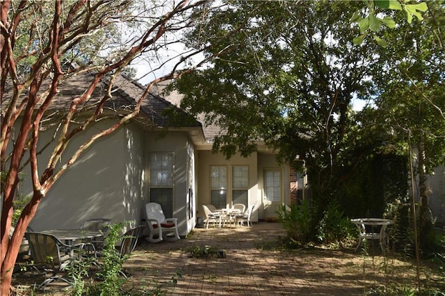 back of property featuring a patio area