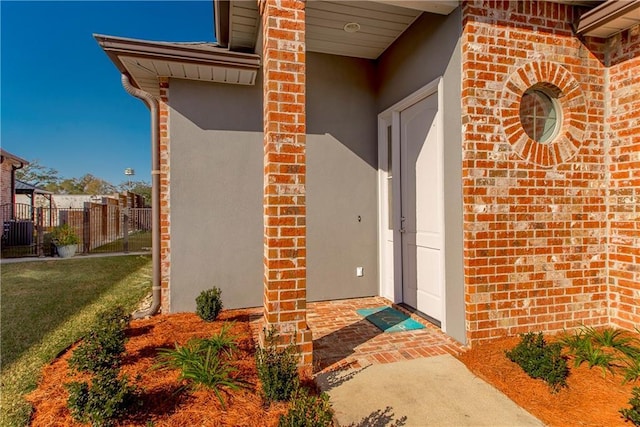 doorway to property with a yard