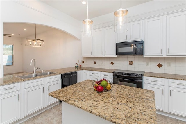 kitchen featuring black appliances, white cabinetry, and sink