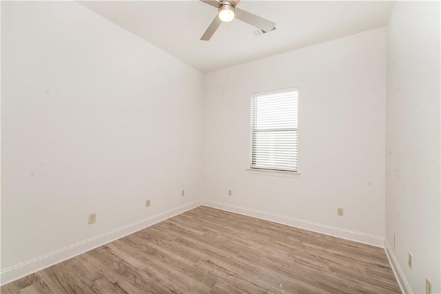 empty room featuring light hardwood / wood-style flooring and ceiling fan