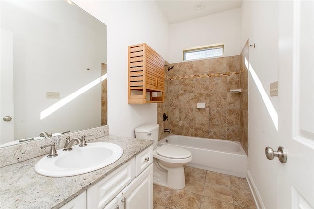 full bathroom with tiled shower / bath combo, toilet, and vanity