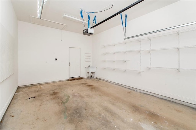 garage featuring a garage door opener and sink