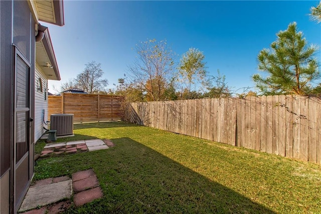 view of yard with central AC