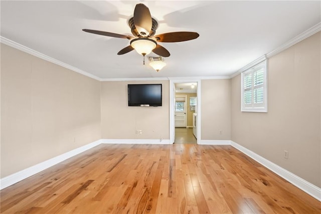 unfurnished room featuring ceiling fan, light hardwood / wood-style floors, and ornamental molding