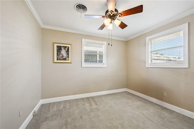 unfurnished room featuring crown molding, ceiling fan, and light colored carpet