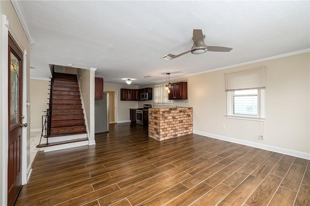 unfurnished living room featuring a textured ceiling, dark hardwood / wood-style floors, ceiling fan, and crown molding