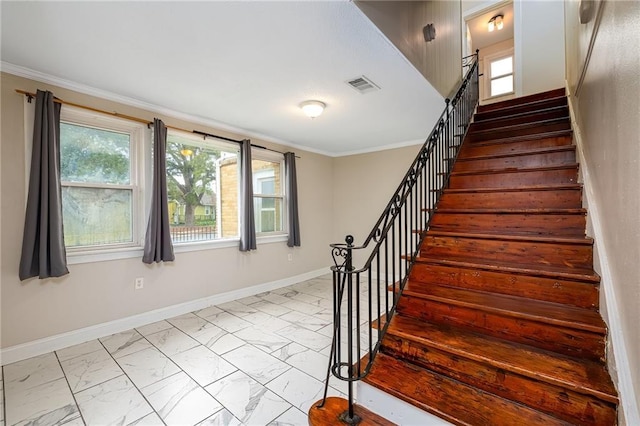 2501 Sage St, New Orleans, LA 70122 - staircase featuring visible vents, ornamental molding, marble finish floor, and baseboards