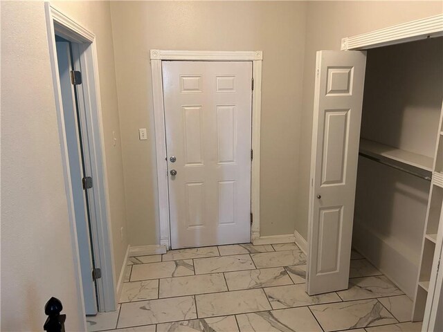 2501 Sage St, New Orleans, LA 70122 - foyer featuring marble finish floor and baseboards