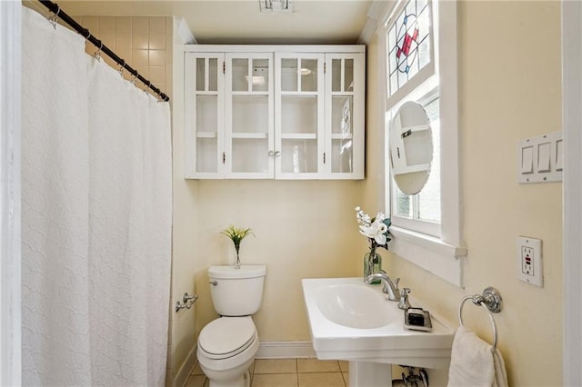 bathroom with sink, tile patterned floors, and toilet