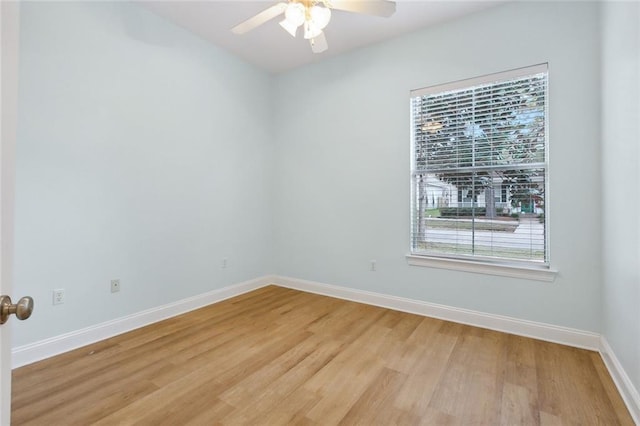 spare room featuring light hardwood / wood-style floors and ceiling fan