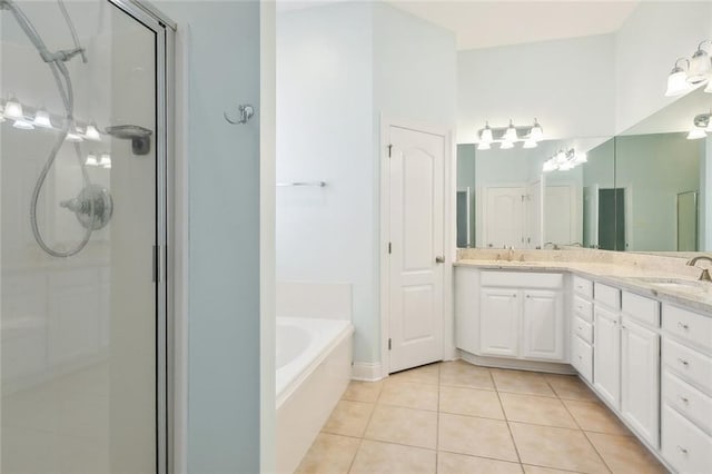 bathroom featuring separate shower and tub, tile patterned flooring, and vanity