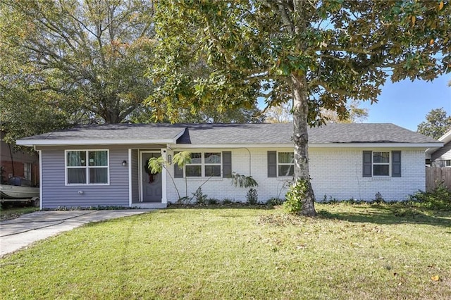 ranch-style home featuring a front yard