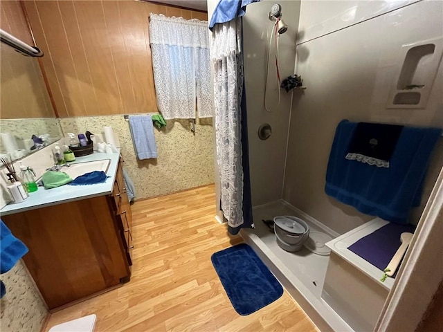 bathroom featuring hardwood / wood-style floors, vanity, and a shower with curtain