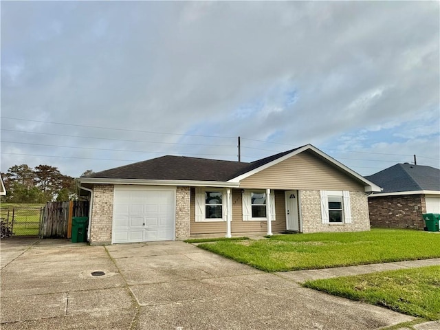 ranch-style home with a garage and a front lawn