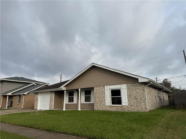 single story home featuring a garage and a front yard