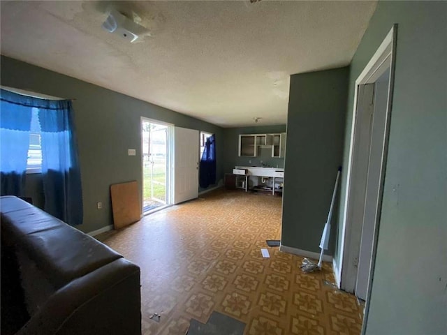 living room featuring a textured ceiling