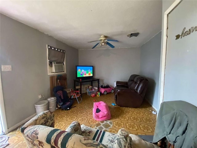 living room with ceiling fan and cooling unit